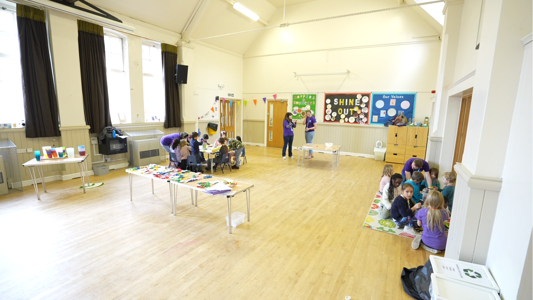 Children doing activities in a hall