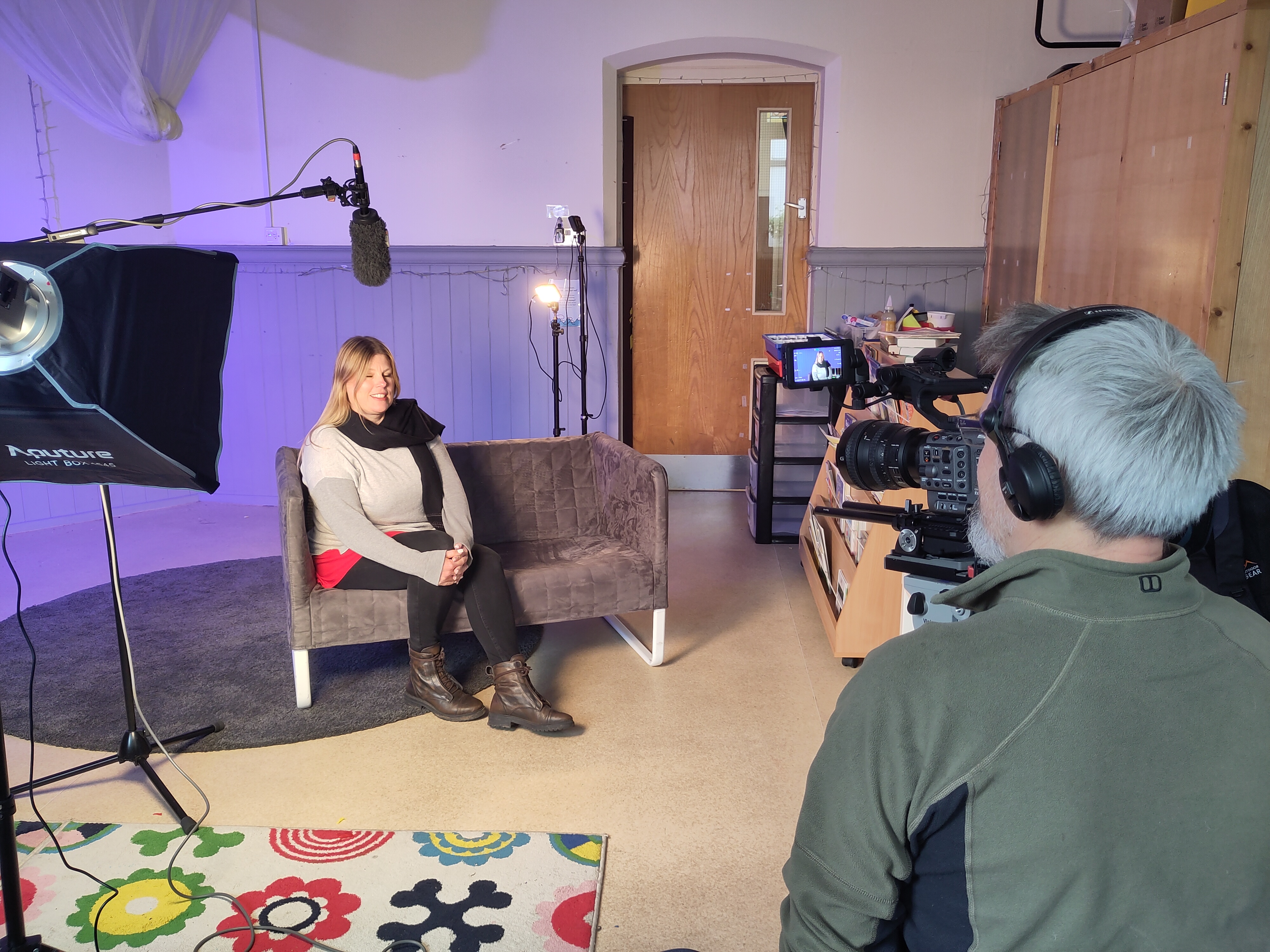 Woman speaking to a camera